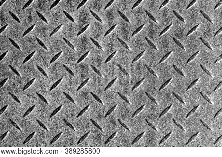 Abstract Background Of Old Grey Rusty Diamondplate Rusty Metal Panel. Grunge Brown Rough Grip Indust
