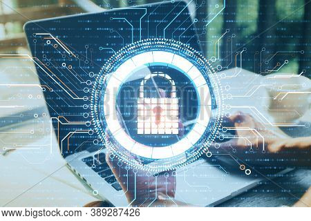 Side View Of Hands Using Phone And Laptop With Glowing Digital Padlock Interface. Safety And Protect