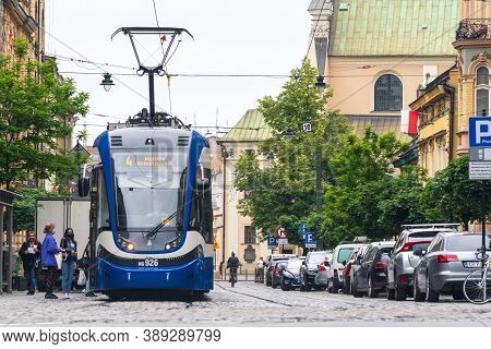 Modern City Blue Tram Pesa On The City Crakow Street. Eco-friendly Urban Public Transport. Urban For