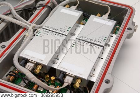 Catv System Hanging On Black Optical Fiber Cables For Amplify Tv Signals Installed With Coaxial Cabl