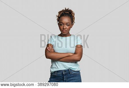 Irritated Young Black Woman Looking At Camera Over Grey Studio Background, Copy Space. African Ameri