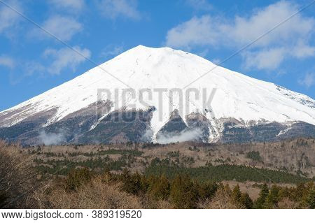 Beautiful View Of Mount Fuji Snow Covered In Winter With Blue Sky And White Clouds. Photo Taken From
