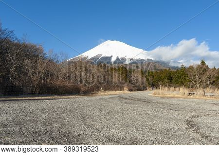 Mount Fuji Snow Covered In Winter With White Clouds And Blue Sky. Photo Taken From Nishiusuzuka Park