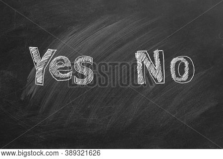 Yes And No Text Written In Chalk On A Blackboard. Your Choice Concept.