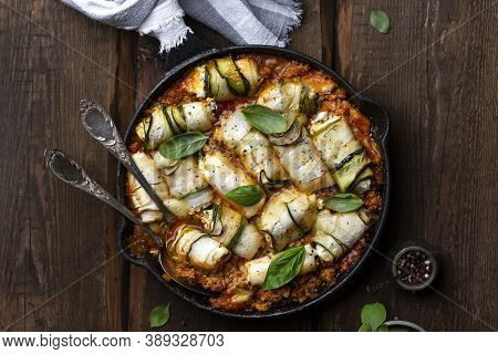 Baked Zucchini Rolls With Ricotta Cheese And Herbs In Meat Ragu Bolognese And Basil