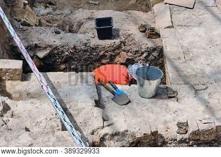 Archaeological Excavations Of Buildings Of Historical Heritage. Male Archaeologist Working Undergrou