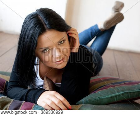 young woman lying on the floo
