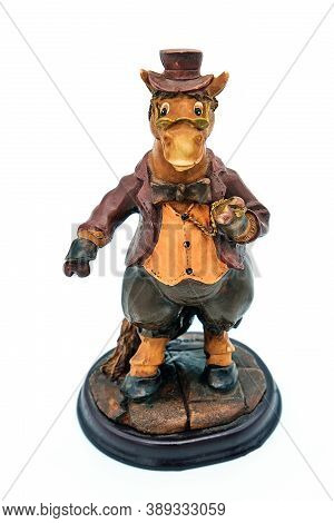 White Background, Isolate. Funny Sketch, Humor In The Form Of A Statuette Donkey. Statue Of A Donkey