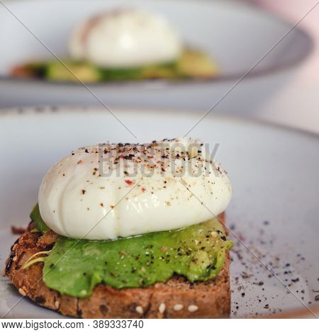 Breakfast On A Plate - Poached Eggs On Bread With Avocado, Close-up, Lifestyle