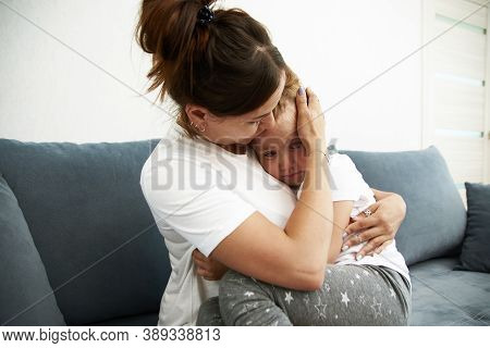 The Mother Pities Daughter.the Little Girl Is Sad. Mother Becalms Litlle Girl.