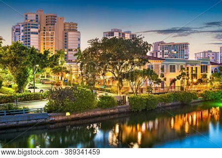 Naples, Florida, USA downtown cityscape on the bay at dusk.