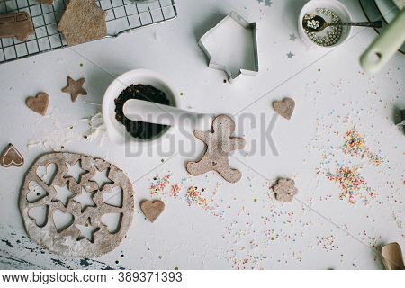 wooden toy dolls and a molded tin on the table for Christmas celebrations