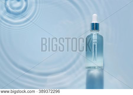 Cosmetic Spa Medical Skin Care, Bottle For Serum, Micellar Toner And Emulsion On Water Texture Backg