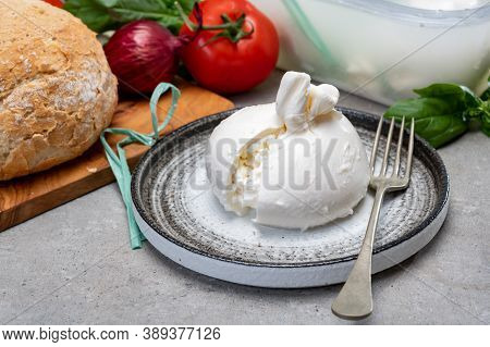 Eating Of Fresh Handmade Soft Italian Cheese From Puglia, White Balls Of Burrata Or Burratina Cheese