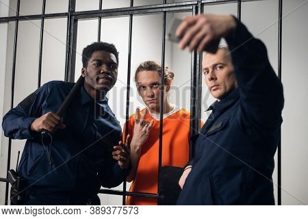 Wardens In A Maximum Security Prison Take Selfies With A Prisoner With Tattoos On His Face, Who Is S