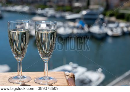 Summer Party With Sparkling Champagne Wine And Sail Boats Haven Of Port Grimaud On Background, Prove