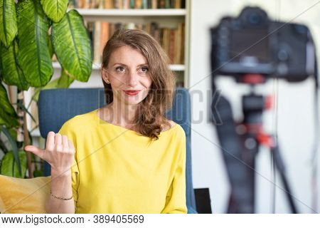 teacher or vlogger recording a lesson on camera online learning
