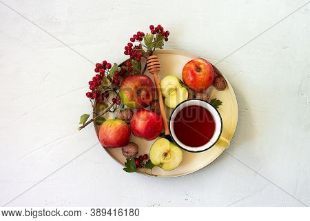 Cozy Autumn Hot Tea With Honey, Apples And Red Hawthorn Berries On A Tray. Still Life On White Backg