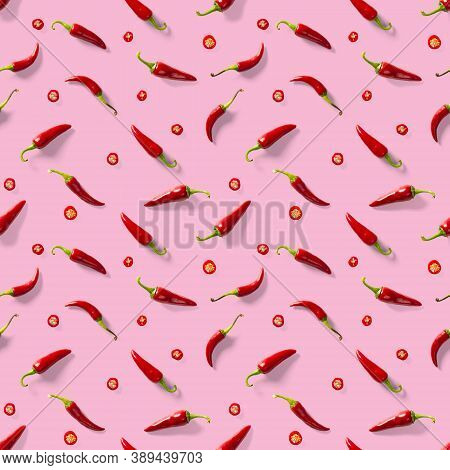 Seamless Pattern Made Of Red Chili Or Chilli On Pink Background. Minimal Food Pattern. Red Hot Chill