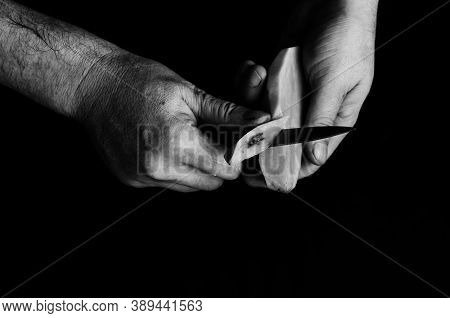 Close-up Of A Man's Hands Carving A Rotten Piece From A Raw Potato. Mature Man Prepares Food. Select