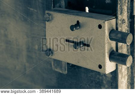 Close-up Of A Massive Door Lock On A Metal Door. The Inner Part Of The Door With A Large Anti-vandal