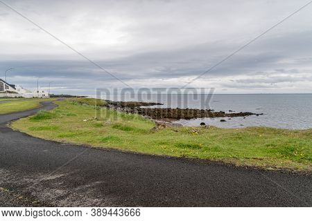 Seashore And Pedestrian Road To Grotta Lighthouse On The Seltjarnarnes Peninsula.