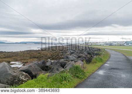 Sculpture And Shore Walk At Cloudy Day At Seltjarnarnes, Iceland.