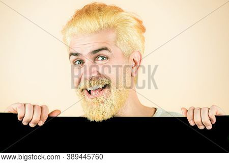 Man Holding A Blank Billboard Isolated On Background. Blank, Empty Paper, Billboard With Copy Space 