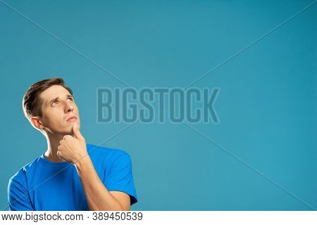 Puzzled Man. Make Decision. Information Banner. Create Idea. Doubtful Guy Looking Up Holding Chin Ha