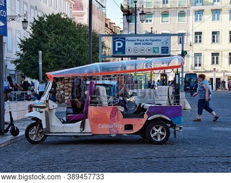 Lisbon, Portugal - October 01, 2019:  Tuk Tuk Waiting For Tourists Or Passengers At The Figueira Pla