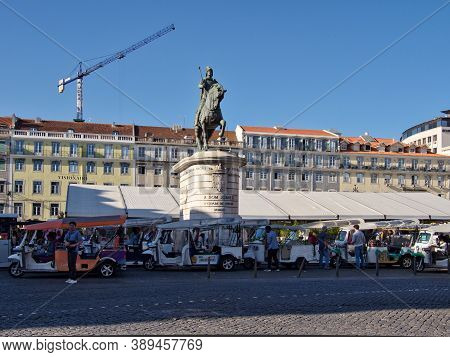 Lisbon, Portugal - October 01, 2019:  Tuk Tuks Lining Up And Waiting For Tourists Or Passengers At T
