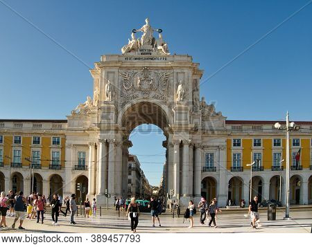 Lisbon, Portugal - October 01, 2019:  People Walking In Front Of  The Rua Augusta Arch Which Is A Tr