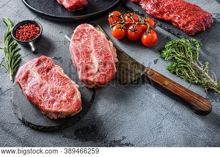 Organic Feather Steak  Steak On Chopping Board, Marbled Beef Over Other Alternative Cuts  With Herbs