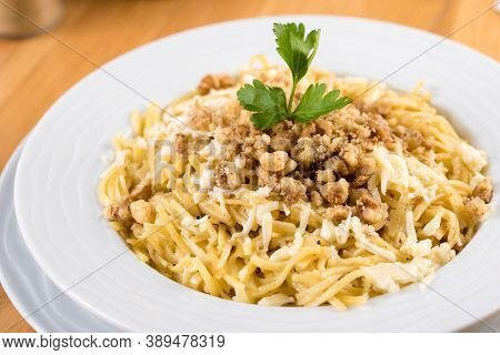 Turkish Noodle / Eriste With Cheese, Walnuts On Wooden Background