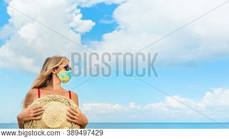 Funny Children In Sunglasses, Inflatable Toys On Tropical Sea Beach. New Rules To Wear Cloth Face Co