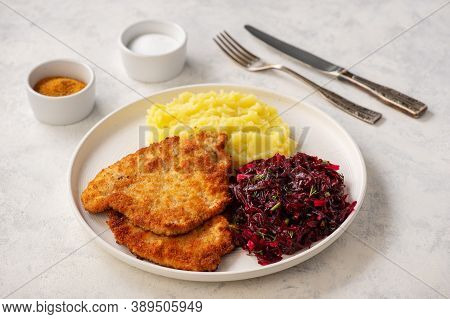 Chop Pork Cutlets , Served With Mashed Potatoes And Beetroot Salad.