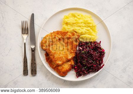 Chop Pork Cutlets , Served With Mashed Potatoes And Beetroot Salad.