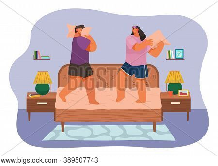 Couple Fighting Pillows, Playing Childhood Game, Have Fun Together At Home. Man And Woman Rejoice St