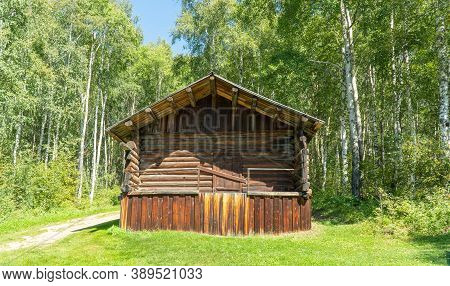 Old Wooden Building In The Forest. Russian Barn. Ancient, Wooden Architecture