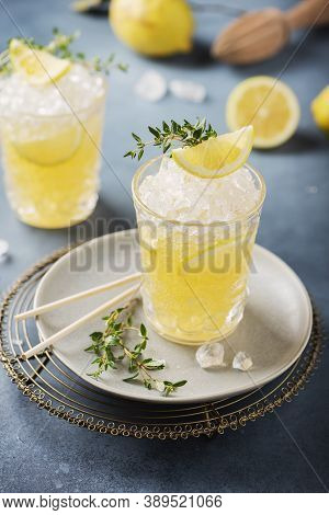 Cocktail With Lemon, Timo And Crushed Ice