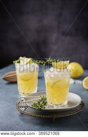 Cocktail With Lemon, Timo And Crushed Ice