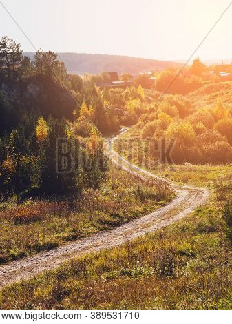 Autumn Rural Road Landscape. Autumn Forest Path Through The Field. Road Track In Rural Areas. Natura