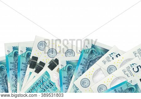 5 British Pounds Bills Lies On Bottom Side Of Screen Isolated On White Background With Copy Space. B
