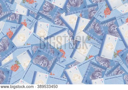 1 Malaysian Ringgit Bills Lies In Big Pile. Rich Life Conceptual Background