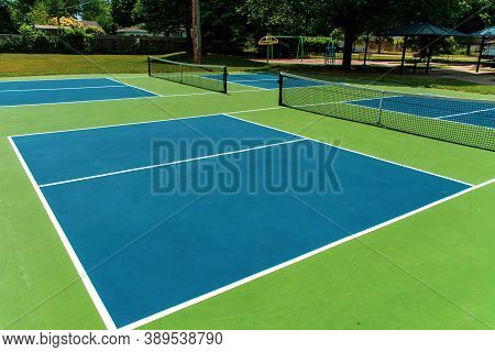 Recreational Sport Of Pickleball Court In Michigan, Usa Looking At An Empty Blue And Green New Court