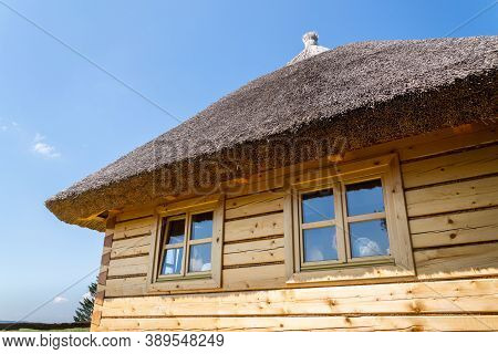 Detail Of Traditional Thatched Roof From Straw Or Reed On Sunny Summer Day