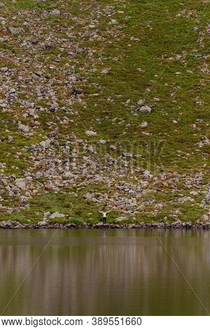 Alpine Lake Brebeneskul, The Cradle Of The Carpathians, A Couple Of Tourists Near The Lake, Reflecti