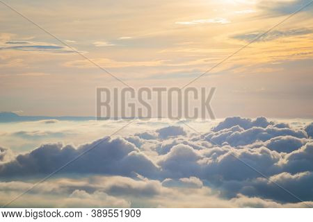 View At Sunrise With Puffy Foggy. White Puffy Like Cloud Stretching To Foggy Horizon In The Bright M