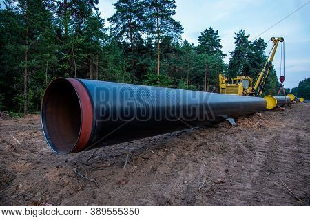Pipelayer With Side Boom Installation Of Gas And Crude Oil Pipes In Ground. Construction Of The Gas