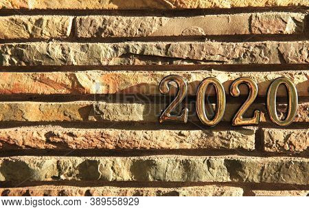 Autumn Or Fall Of 2020. Inscription In Golden Numbers 2020 On The Stone (docorative Bricks) Wall, Sy